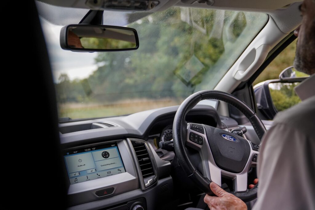 Interior of Ford Ranger while driving off road looking at steering wheel