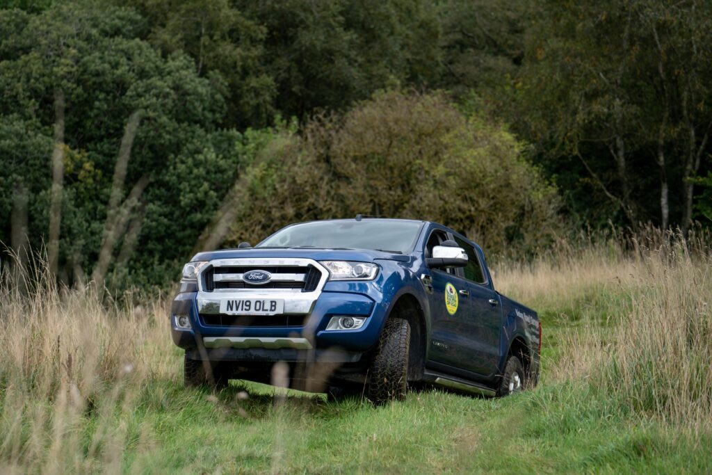 Ford Ranger climbing hill off road at work