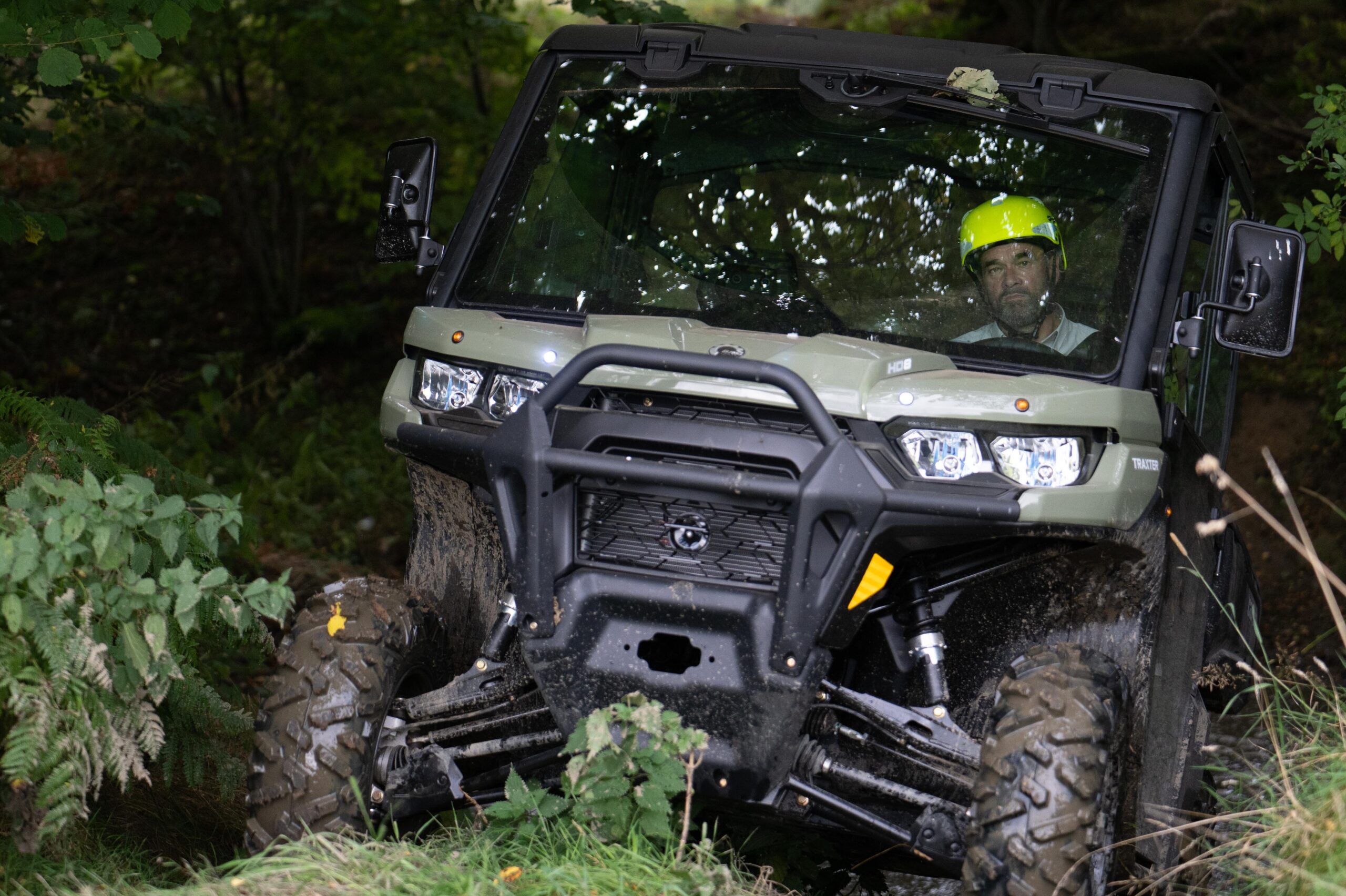 Can-AM UTV driving through water splash off road